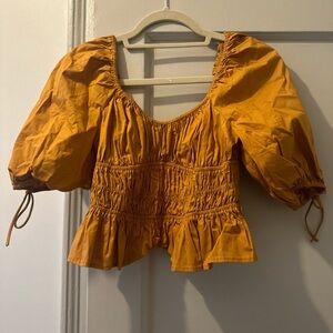 Staud peplum orange top, never worn, size small